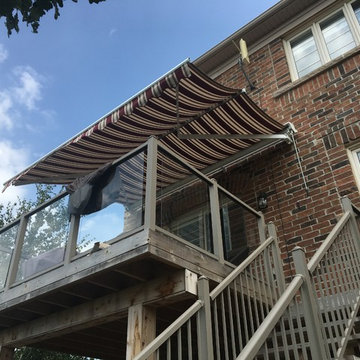 Retractable awning on 2nd level deck with Support Posts