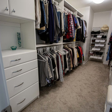 White Vanity with Freestanding Tub and Tiled Shower with Closet Storage