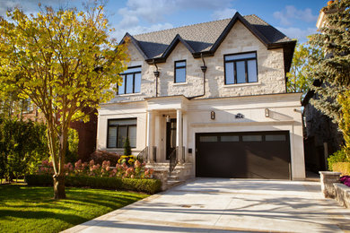 Large transitional three-story house exterior photo in Toronto