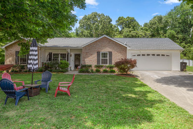 Example of a mid-sized trendy exterior home design in Other