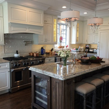 Schuler Cabinetry - Sheffield Door in Divinity Paint and Eagle Rock Island