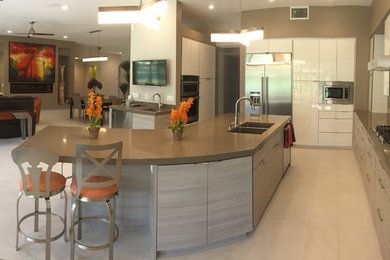 Inspiration for a large modern u-shaped white floor and ceramic tile eat-in kitchen remodel in Other with a double-bowl sink, flat-panel cabinets, white cabinets, stainless steel appliances, an island and quartzite countertops
