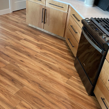 Angled Kitchen Design with Slab Style Cabinets in Pecan Stain
