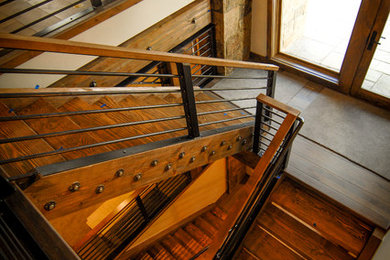 Staircase - mid-sized rustic l-shaped metal railing staircase idea in Denver