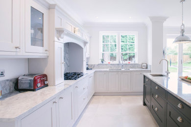 Design ideas for a large grey and black u-shaped open plan kitchen in Sussex with shaker cabinets, grey cabinets, quartz worktops, grey splashback, stone slab splashback, porcelain flooring, an island, grey floors, grey worktops, a single-bowl sink, integrated appliances and feature lighting.