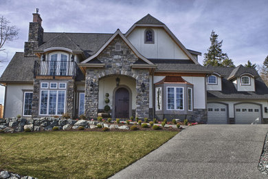 Mid-sized elegant beige two-story mixed siding exterior home photo in Seattle with a clipped gable roof