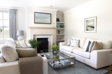 Rural living room in West Midlands with a standard fireplace and a stone fireplace surround.