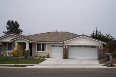 Mid-sized cottage beige one-story stucco house exterior idea in San Luis Obispo with a hip roof