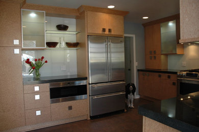 Inspiration for a mid-sized contemporary u-shaped cork floor eat-in kitchen remodel in Other with an undermount sink, flat-panel cabinets, light wood cabinets, granite countertops, white backsplash, glass tile backsplash, stainless steel appliances and no island