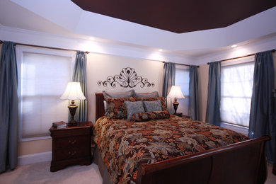 This is an example of a traditional bedroom in Charlotte.