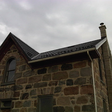 Ontario stone houses with Hy-Grade's permanent "cure" from roof shingles