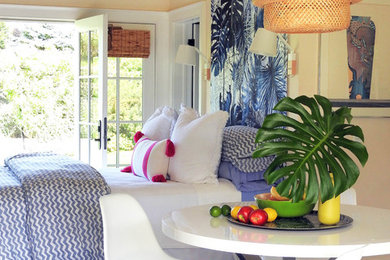 Bedroom - small coastal guest ceramic tile and beige floor bedroom idea in New York with white walls and no fireplace