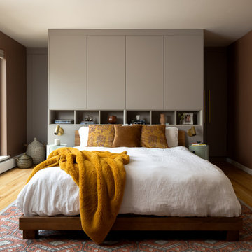 Primary Bedroom with Custom Headboard Storage and Wall Cabinetry