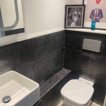 Damaged Sealer Replaced on Black Slate Wall Tiles in a Penge Bathroom