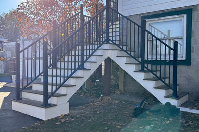Large arts and crafts backyard metal railing deck photo in Other with no cover