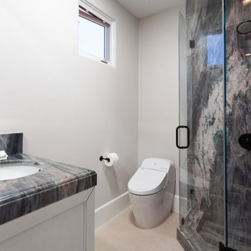 Secondary Bathroom with Full Slab Walk-In Shower in Dramatic Dark Stone – Newpor