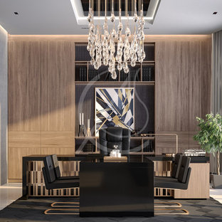 This is an example of a large modern study in London with multi-coloured walls, porcelain flooring, no fireplace, a freestanding desk and white floors.