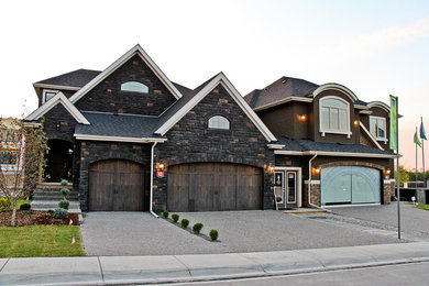Example of a transitional exterior home design in Calgary