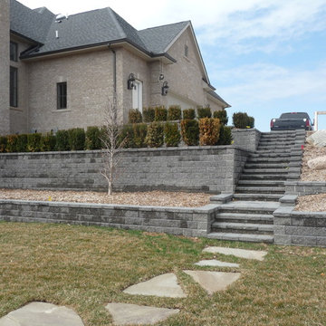 Tiered Unilock Pisa Retaining Walls with a Staircase & Paver Landings