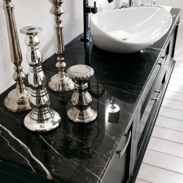 Traditional bathroom with black distressed vanity with black top