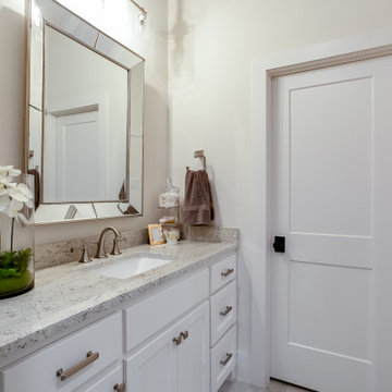 Lantana Guest Suite: White Granite & Beveled Mirror Details