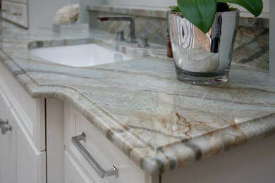 Inspiration for a modern master bathroom in Atlanta with quartzite benchtops, recessed-panel cabinets and white cabinets.