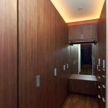 Hidden feline passageway in a luxury his-and-hers master closet