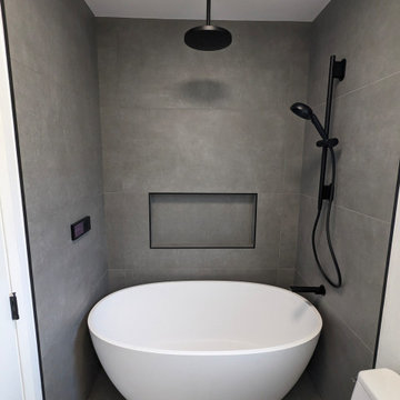 Ultra-Modern Smart Bathroom with Terrazzo Floor & Oval Soaking Tub