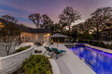 Pool fountain - large transitional backyard stone and rectangular lap pool fountain idea in Austin