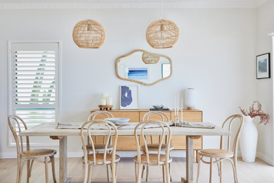 Inspiration for a beach style dining room in Sydney.