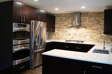 Eat-in kitchen - small contemporary galley medium tone wood floor eat-in kitchen idea in Austin with flat-panel cabinets, solid surface countertops, stone tile backsplash, stainless steel appliances and a peninsula