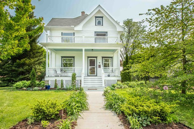Inspiration for a mid-sized victorian porch remodel in Other