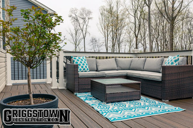 Inspiration for a mid-sized modern backyard second story mixed material railing deck remodel in Other