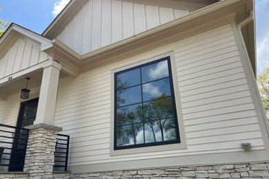 Example of a white concrete fiberboard house exterior design in Atlanta