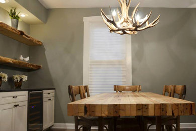Mid-sized mountain style dark wood floor and brown floor dining room photo in Chicago with gray walls and no fireplace