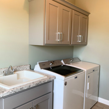 New Home With Warm-Stained Hickory Kitchen and Stylish Bathroom Tile
