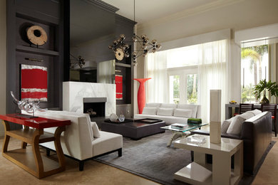 Living room - large contemporary concrete floor living room idea in Miami with black walls and a standard fireplace