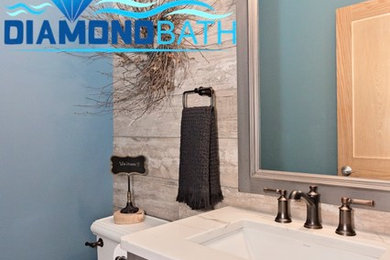 Small transitional master gray tile and ceramic tile ceramic tile and gray floor bathroom photo in Chicago with beaded inset cabinets, gray cabinets, a two-piece toilet, blue walls, an undermount sink, quartz countertops and white countertops