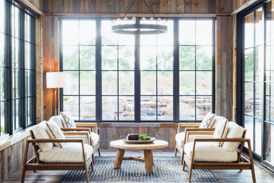 Inspiration for a rustic medium tone wood floor and multicolored floor sunroom remodel in Dallas