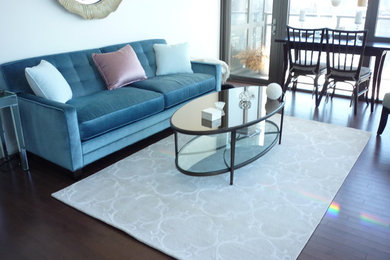 Inspiration for a mid-sized timeless formal and open concept dark wood floor and brown floor living room remodel in New York with white walls, no fireplace and no tv