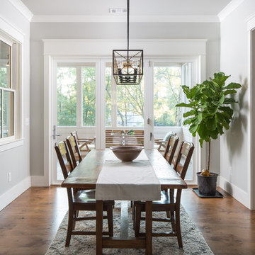 Farmhouse Dining Room with Trestle Table and French Doors to Porch