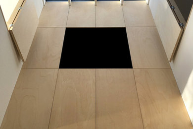 Exemple d'une petite véranda tendance avec sol en béton ciré, un puits de lumière et un sol gris.