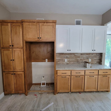 Two-Tone Kitchen Cabinetry with Custom Pantry & Fridge Enclosure