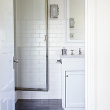 black floor white subway walls