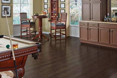 Inspiration for a mid-sized timeless single-wall dark wood floor bar cart remodel in Orange County with shaker cabinets, brown cabinets and solid surface countertops
