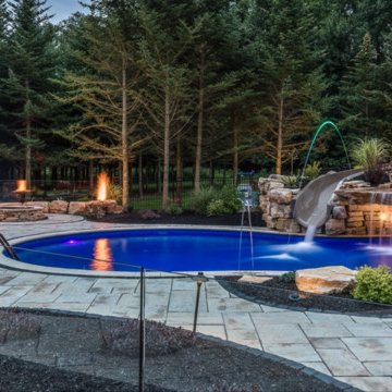 Custom Pool Project with Grotto and Large Waterslide
