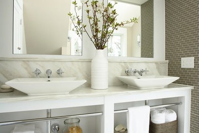 Design ideas for a traditional bathroom in Minneapolis with marble benchtops and a vessel sink.