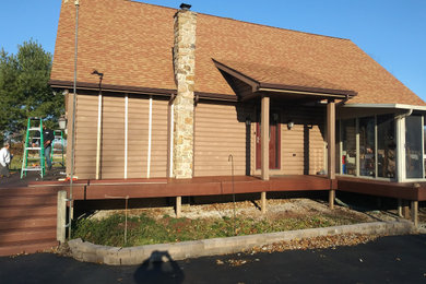 Huge mountain style brown three-story mixed siding exterior home photo in Other with a shingle roof
