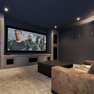 Medium sized contemporary enclosed home cinema in Calgary with grey walls, carpet and a projector screen.