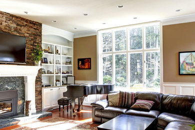 Medium tone wood floor family room photo in Calgary with brown walls, a standard fireplace and a tile fireplace